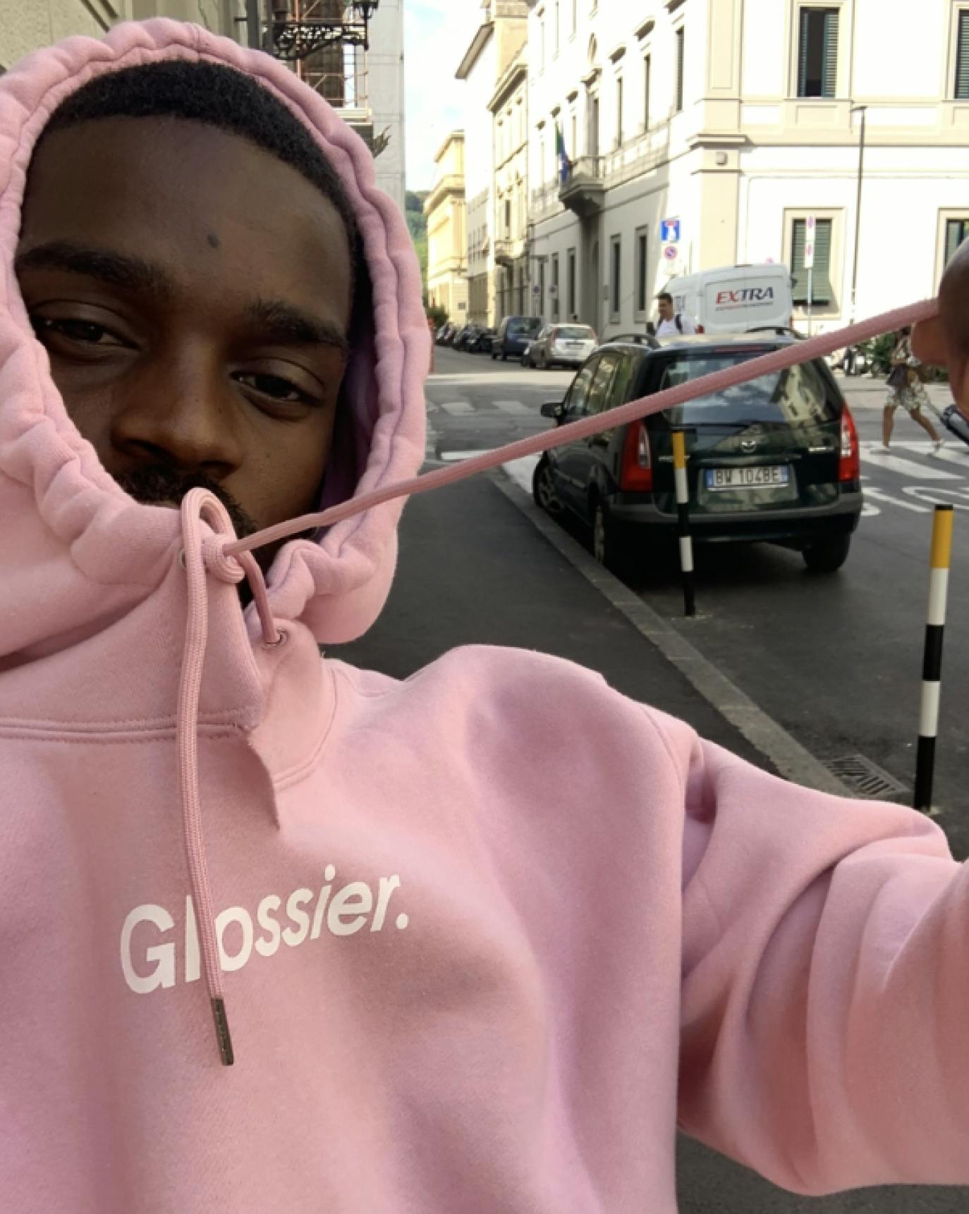Yashua wearing the Pink Hoodie.